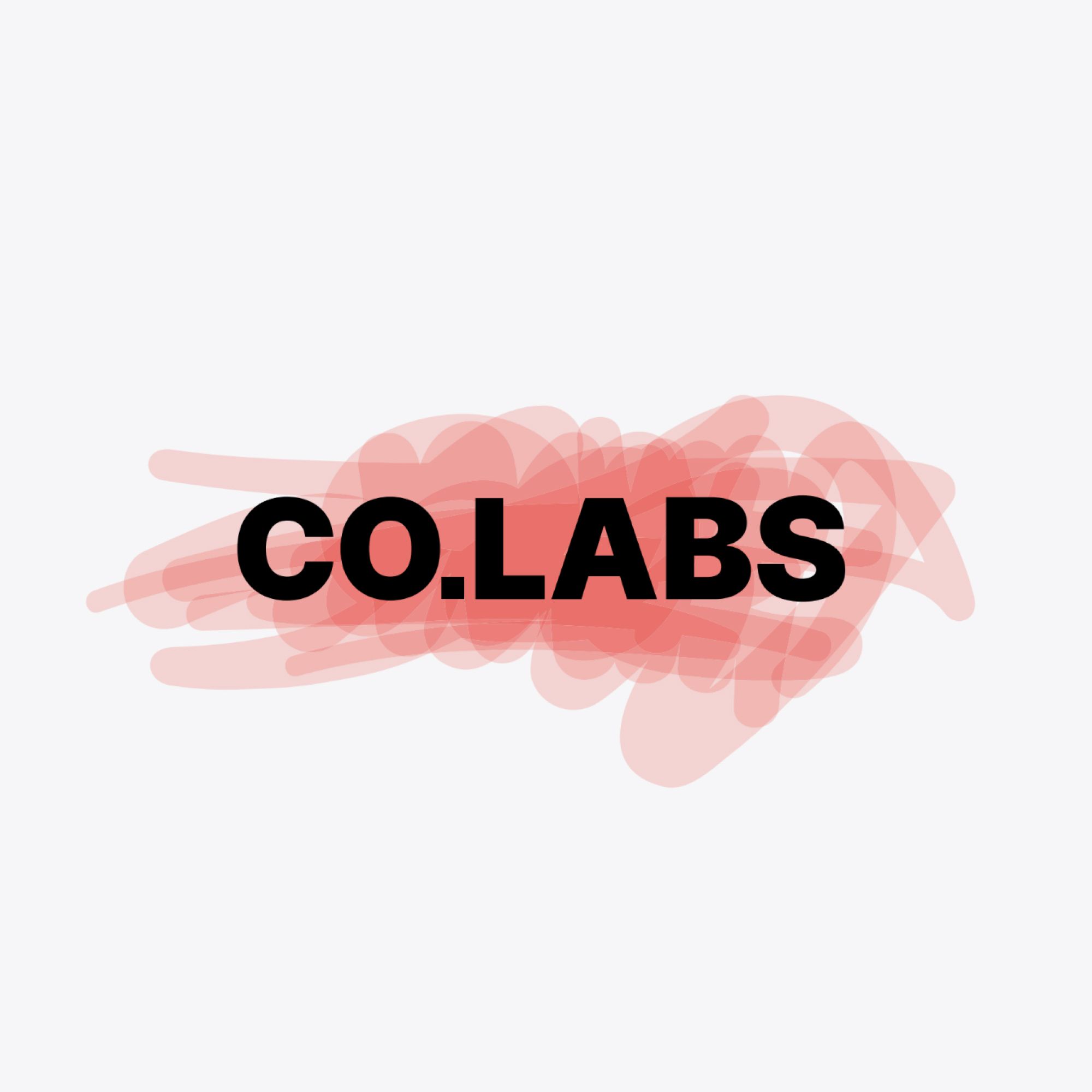 A CO.LABS theatre with the logo concept on its facade as a neon sign